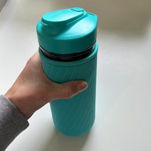 Glass water bottle with turquoise sleeve